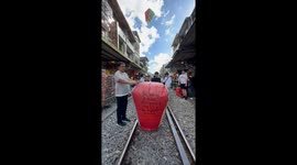 Bad luck! Burning Chinese lantern crashes into home's balcony during annual celebrations