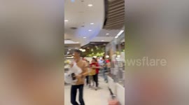 Shoppers run as gunshots are heard in mall in Bangkok, Thailand