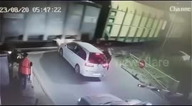 Motorist crashes into moving train while attempting to evade police