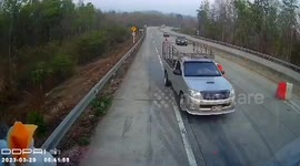 Truck driver stops to remove road barriers dangerously blocking traffic on highway