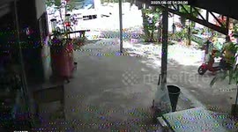 Bungling motorcycle rider crashes into oil drum pump that fall on top of her