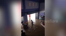 Torrential rain leaves roads and cars submerged in heavy flood in eastern Thailand