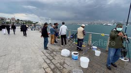 Stockshots: Fishermen fish in the Bosphorus strait in Istanbul, Turkey