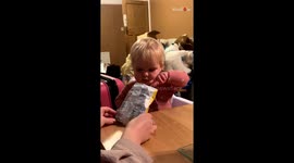 Baby girl's face lights up with joy after she finds a crisp in an 'empty' pack