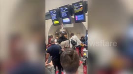 Moment commuters jumped barriers to try and catch train as strikes hit Britain