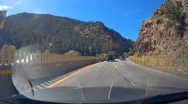 Narrowly Avoiding an SUV Making a U-Turn on a Busy Highway