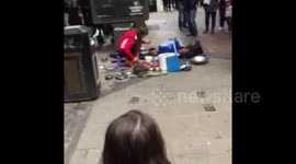 Busker and Police Officer Go Head to Head on Pots and Pans
