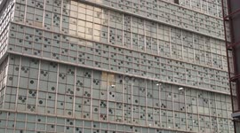 Building designed with bullet hole-like effect on the walls