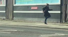 Woman dances her way down street in Liverpool