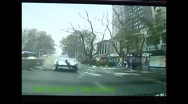 Cadillac losing control crashes two vehicles and bus stop after it rushes out of central reservation