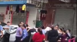 People use bed sheets to catch boy falling from fourth-floor balcony