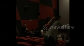 Man with mistress in cinema encountering his wife with lover