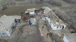 Drone footage of  6 homes shelled in the front line town of Nikolaevka, OSCE inspects