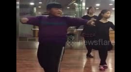 Chinese boy learns hard Latin dance