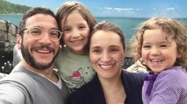 Kid grabs mum in awkward place during family photo