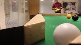Engineers build billiards table and play with leaf blowers
