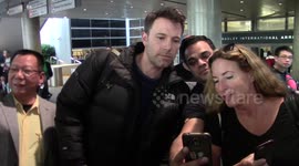 Ben Affleck poses for pictures with fans in LA
