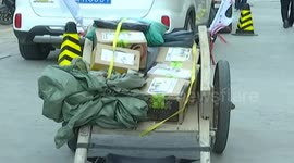 Courier delivers parcels by handcart