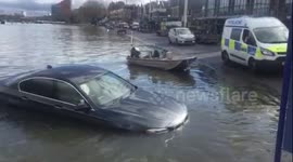 BMW swept into River Thames by tide sinks as it drifts away