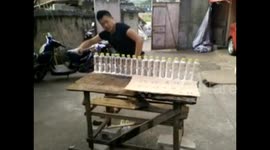 Knife artist chops 16 water bottles in half all at once