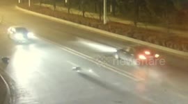 Gas cylinder dropping from lorry is stuck under a car