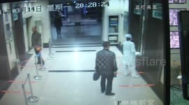 Nurse held by a man in elevator being rescued