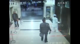 Nurse held by a man in elevator being rescued