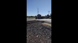 Train Collides With Stuck Semi-Truck's Trailer