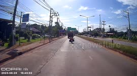 Couple on motorcycle fling themselves to ground to avoid wheels of turning truck