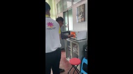 Teacher tries to remove burning food from microwave in cooking fail