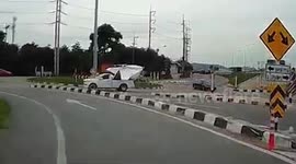Oops! Truck hits low bridge in Thailand, carries on going
