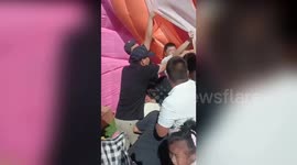 Parents rush to rescue children stuck under bouncy castle in China
