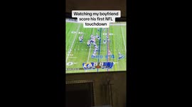 Woman overwhelmed as she watches her boyfriend score his first NFL touchdown