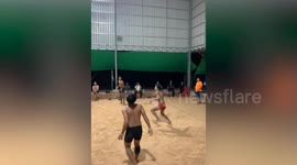 Locals play bizarre mix of volleyball and basketball in Cambodia