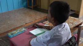 Students flee coastal Thai school as rising sea slowly engulfs village