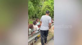 Good Samaritans donate supplies to Thai tribespeople living on roadside