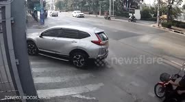 Riderless motorcycle crashes into person waiting at junction