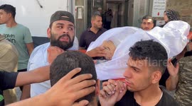 Mourners carry the bodies of Palestinians killed in the latest infiltration operation into Israel, outside al-Shifa hospital in Gaza City