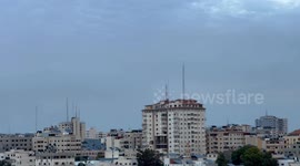 Smoke and flames billow after Israeli forces struck a high-rise tower in Gaza City.