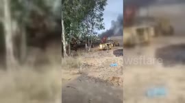 A Palestinian filming the destruction of an Israeli Military base next to Gaza