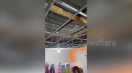 Rain pours through broken roof into home during storm