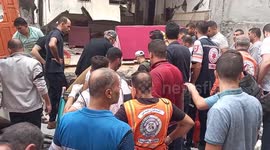 Rescue teams remove bodies from rubble of destroyed house in Gaza