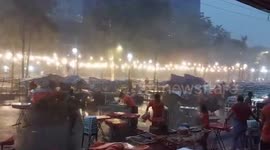 Frantic vendors flee as storm rips through market in the Philippines
