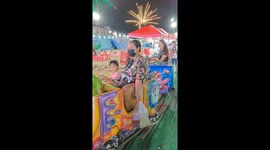Sweet pet Siberian Husky joins children on fairground caterpillar ride
