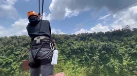 This 850ft-high zipline gives tourists awesomely terrifying ride over twin waterfall in Laos