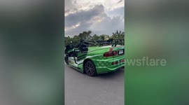 Wacky modified cars cruise on road in Thailand