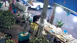 Out-of-control motorcycle trailer crashes into market fruit stall