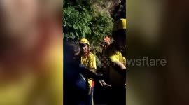 Officials rescue passengers after bus falls into deep gorge in northern India