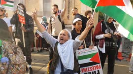 Pro-Palestine protesters gather outside Israeli Embassy in London