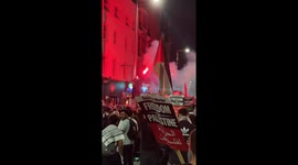 Pro-Palestinian protesters rallied outside the boarded-up Israeli embassy in Kensington on Monday night, chanting “Israel is a terrorist state” and “free Palestine” while letting off flares and fireworks.